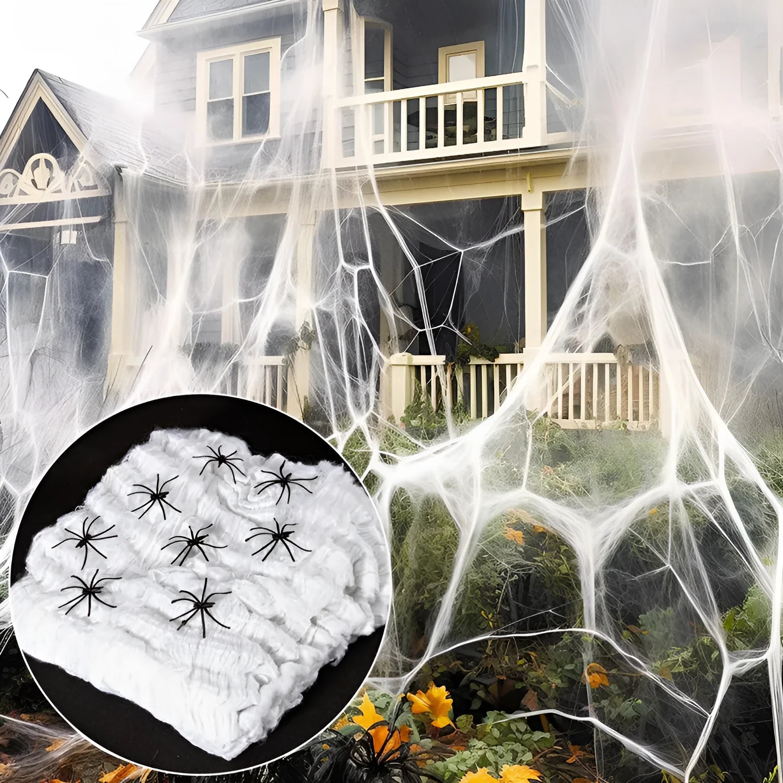 White cotton spider web Halloween decoration with integrated synthetic spiders draped over fence