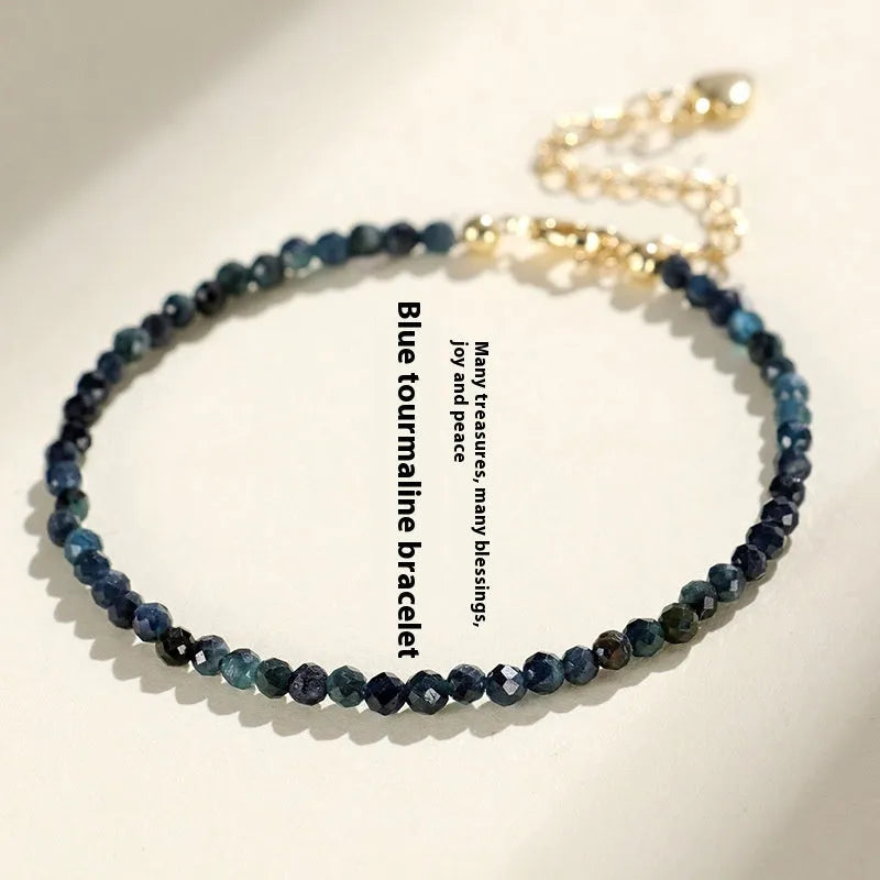 Blue tourmaline beaded bracelet with silver spacer beads and adjustable clasp
