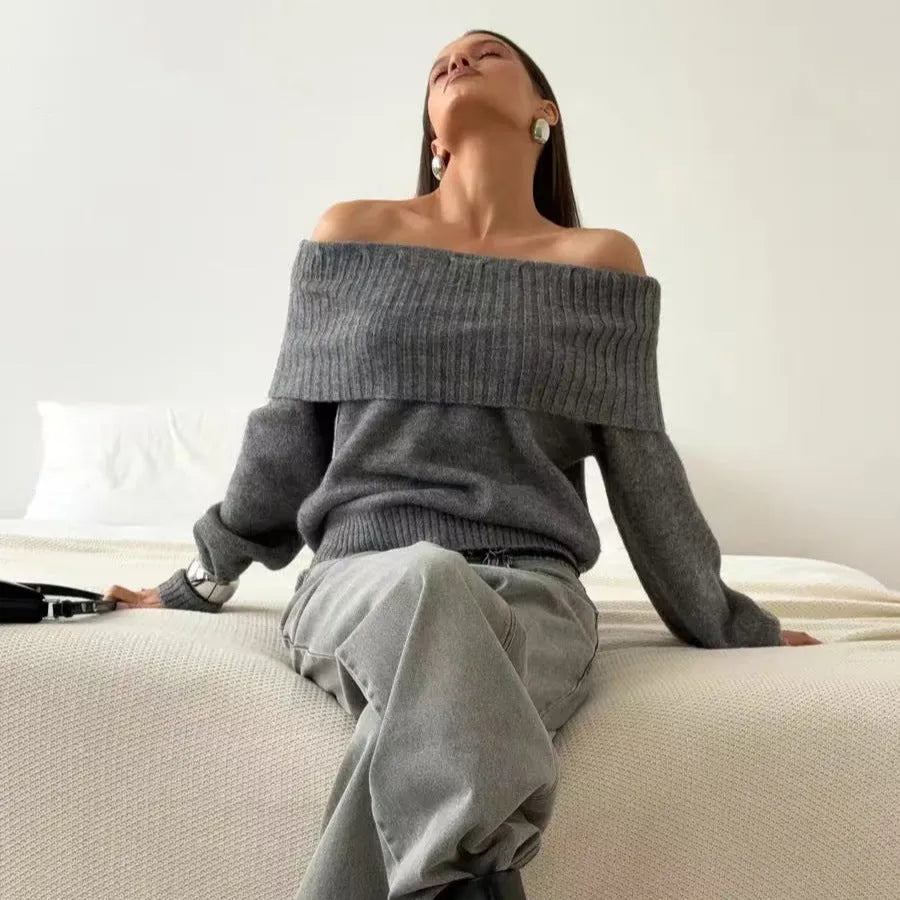 Grey off-the-shoulder strapless pullover sweater with a 3D pattern on a model.