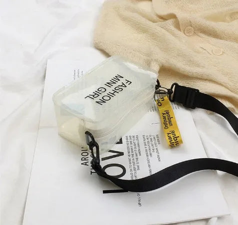 A transparent square jelly crossbody bag with a single adjustable shoulder strap.