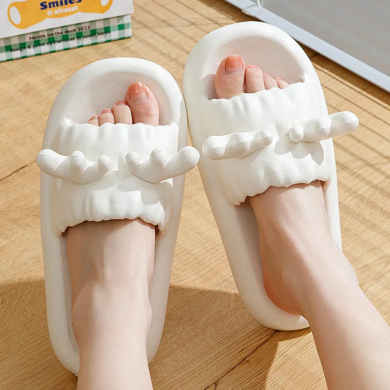 Deer horn design EVA flip flop slippers in light yellow, showing hollow out upper and textured sole.