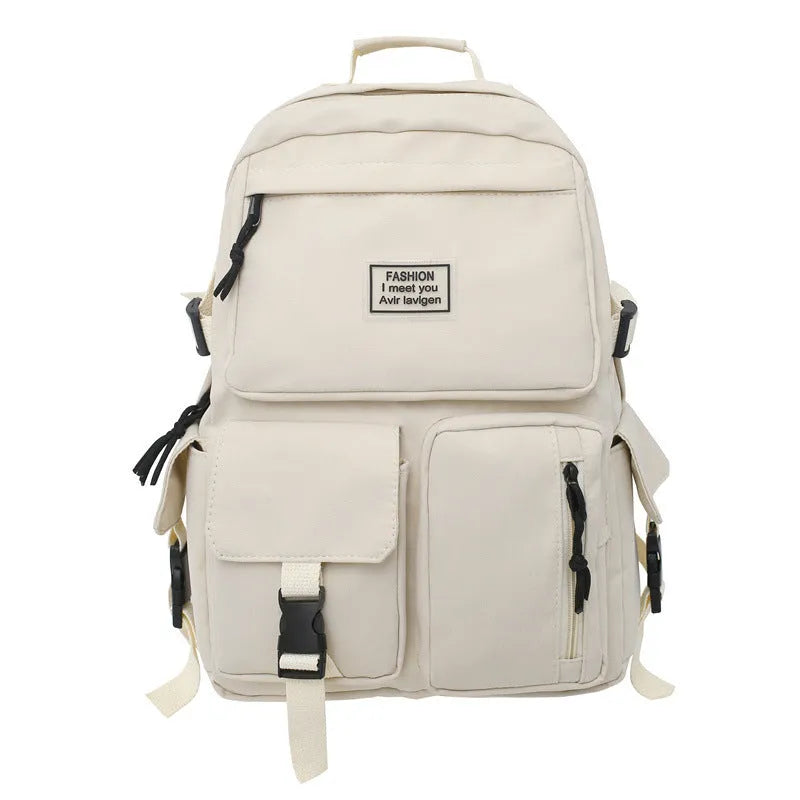 Black and white soft nylon student backpack showing external pockets and internal laptop compartment.