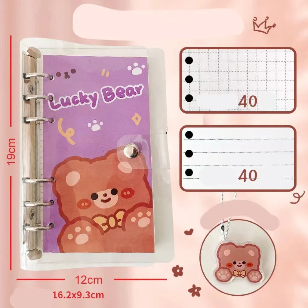 A6 size loose-leaf coil notebook with heart-themed bear design, showing coil binding and 6-hole edge.