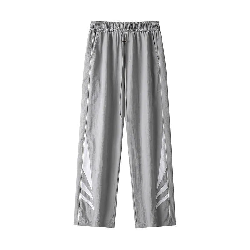 Men's grey straight-leg casual trousers with a loose plus-size fit and button fly.