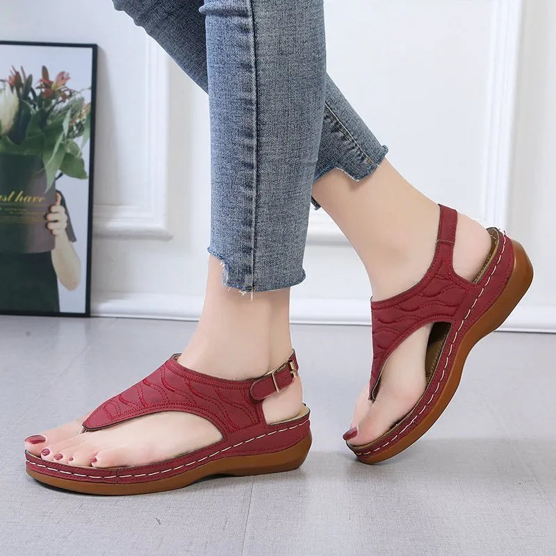 Women's casual wedge heel sandals with adjustable buckle strap in solid red colour