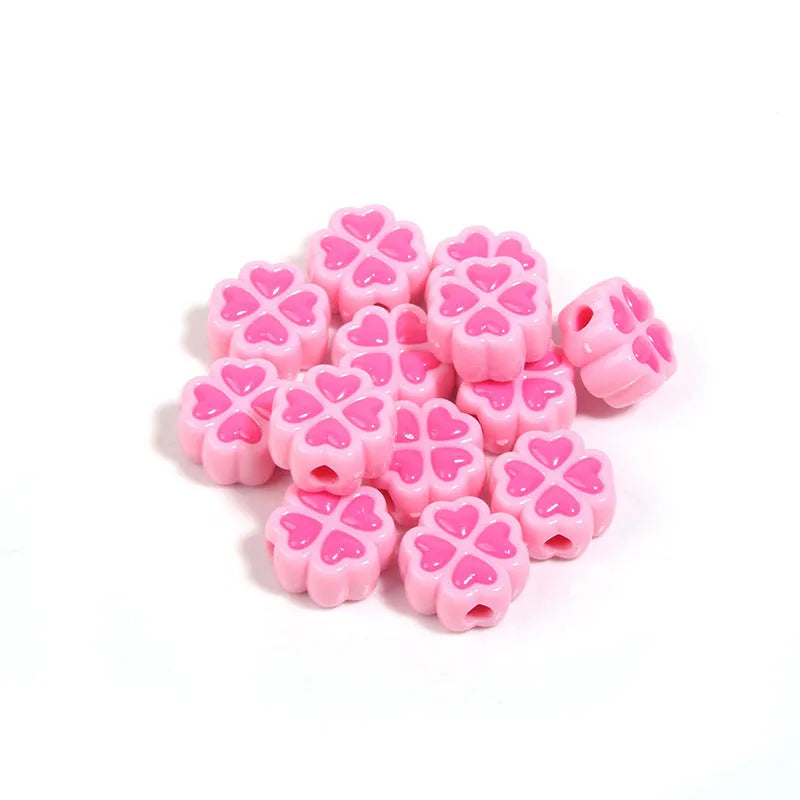 Mixed colour frosted acrylic four-leaf clover shaped beads, each 15mm in size.
