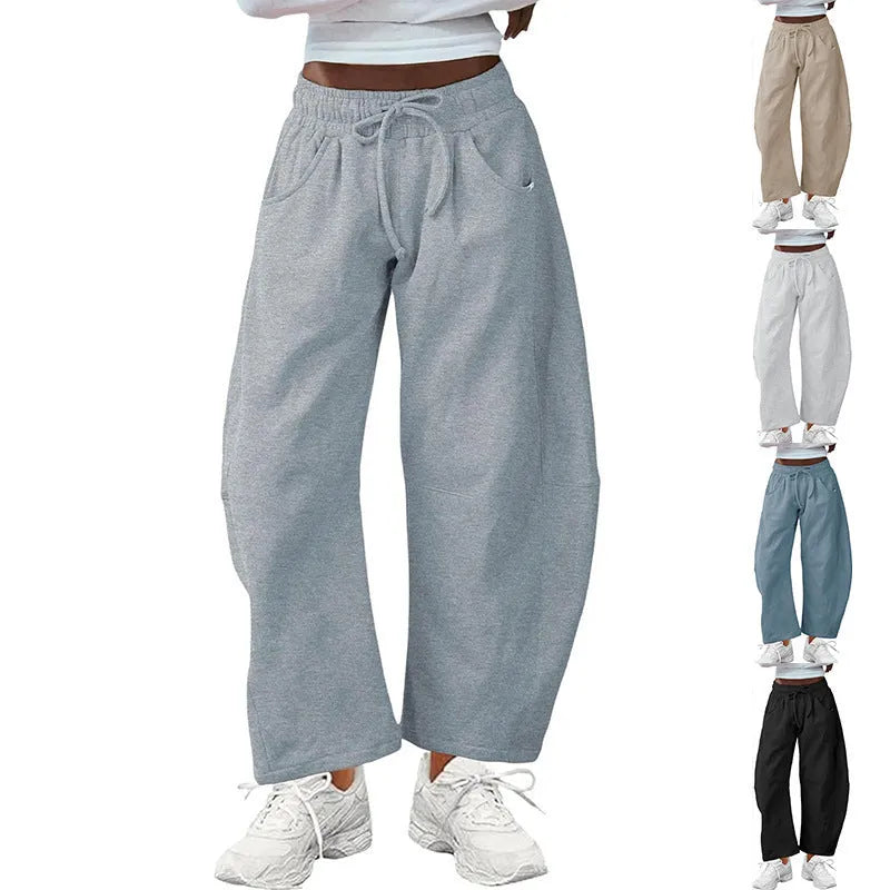Women's loose cotton cropped sweatpants with drawstring waist in street fashion styling