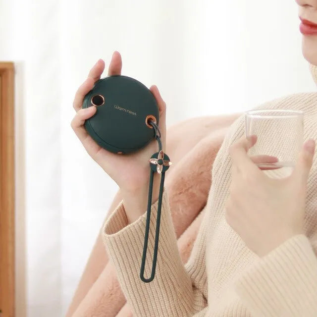 Green hand warmer power bank with digital display showing battery percentage, USB Type-C cable included