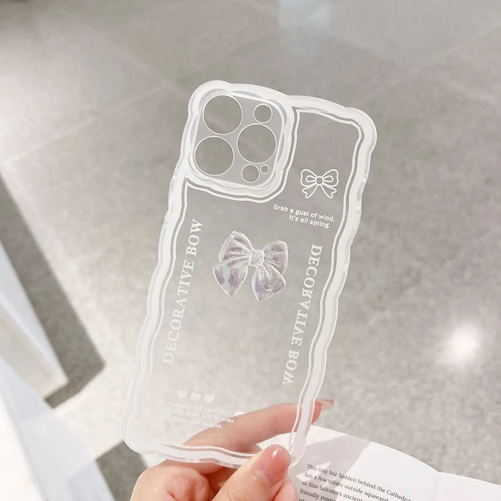 Transparent iPhone case with 3D ice-effect bow decoration on back, optional white lanyard attachment