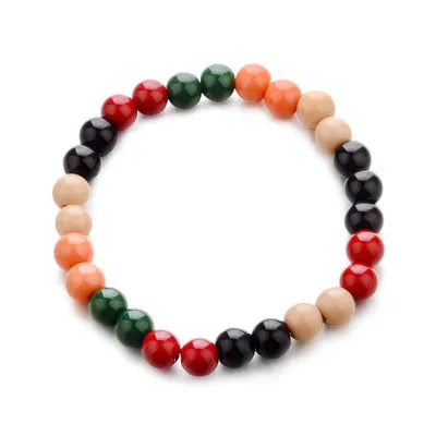 Unisex natural stone beaded bracelet with lava stones on a wrist, showing ethnic style design.