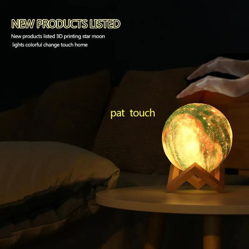 Spherical lunar night light on display, showing colour-changing LED glow with remote control.