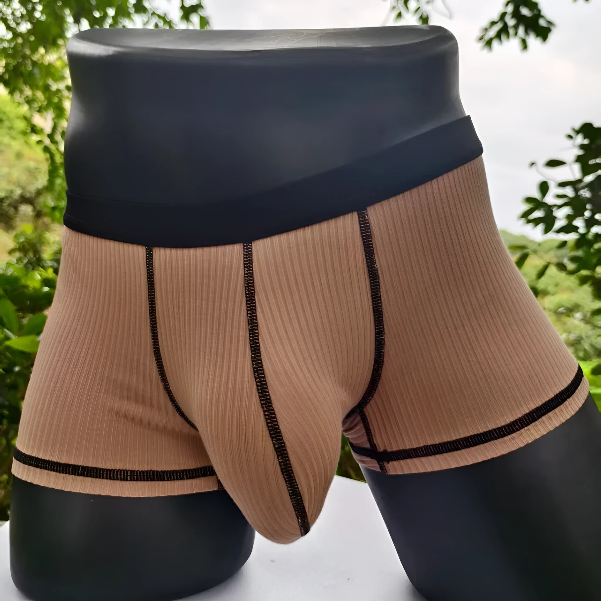 Men's solid colour thin fit boxers showing breathable fabric and body shaping design.