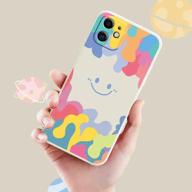 Rainbow smiley face design on white or black camouflage TPU iPhone case with attached carrying lanyard
