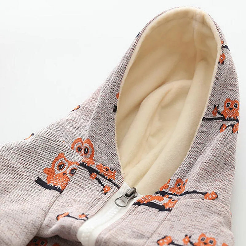 Blue cotton dog sweater with zipper front closure and dog pattern print shown on a pet