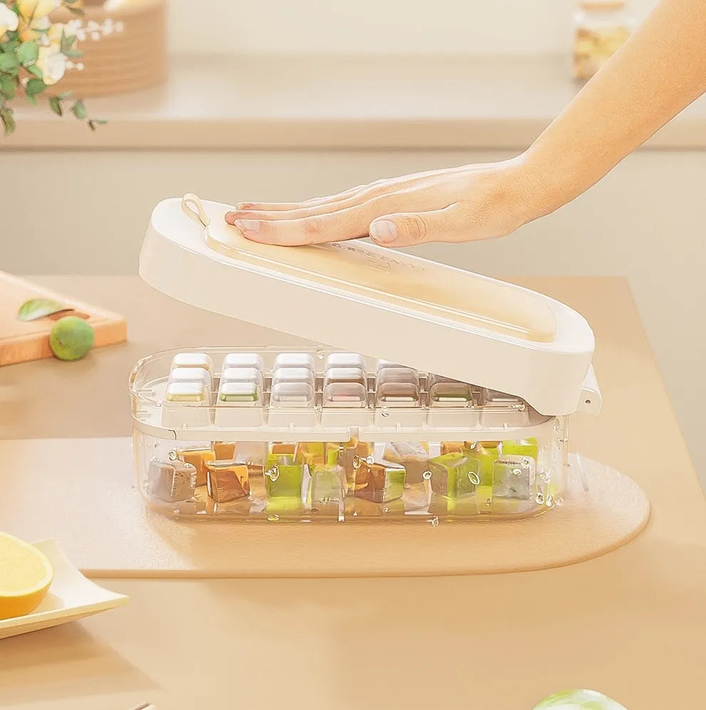 High capacity food grade plastic ice cube tray in blue with an ice shovel stored in its dedicated slot.
