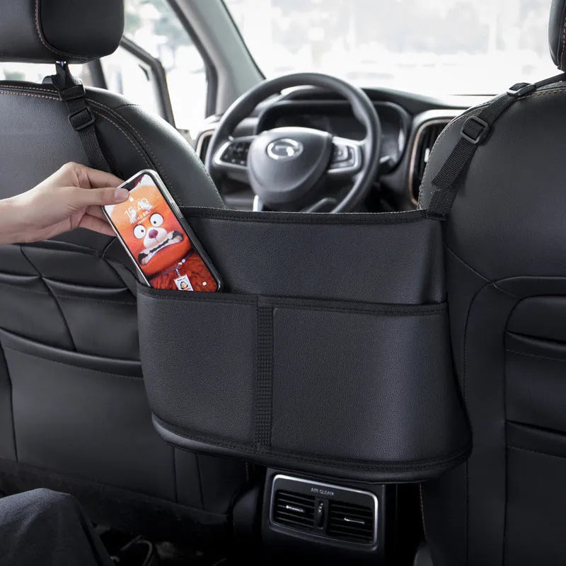 Black leather car seat storage bag with carbon fibre pattern, showing size.