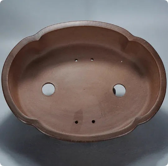 A simple classical-style purple clay bonsai pot for tabletop or floor plant display.