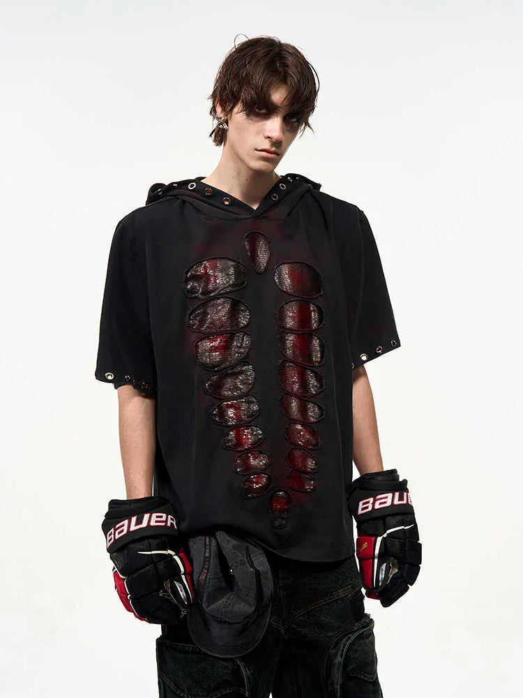 Black men's hooded short-sleeved t-shirt with sequin detailing, loose fit, shown in casual wear setting