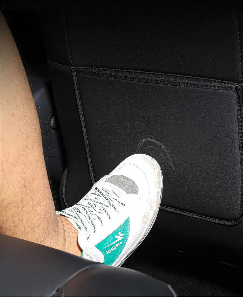 Black leather anti-kick pad for car rear seat protection, showing single pocket.
