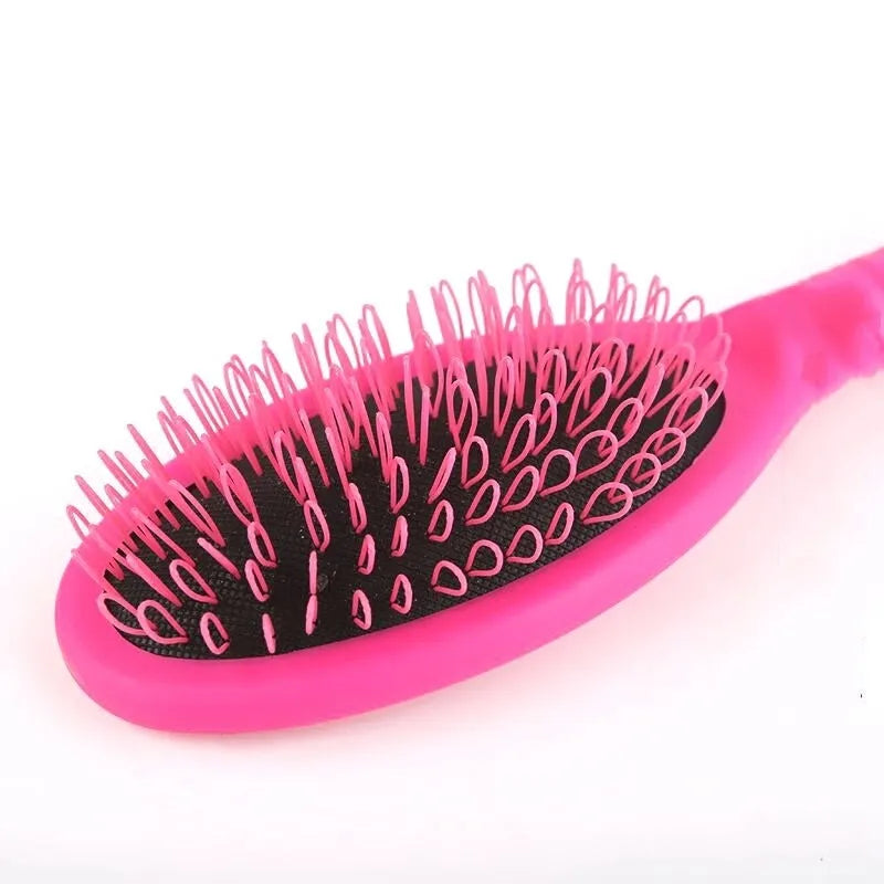 Black ring tooth airbag comb for hair extensions on pink background showing dimensions