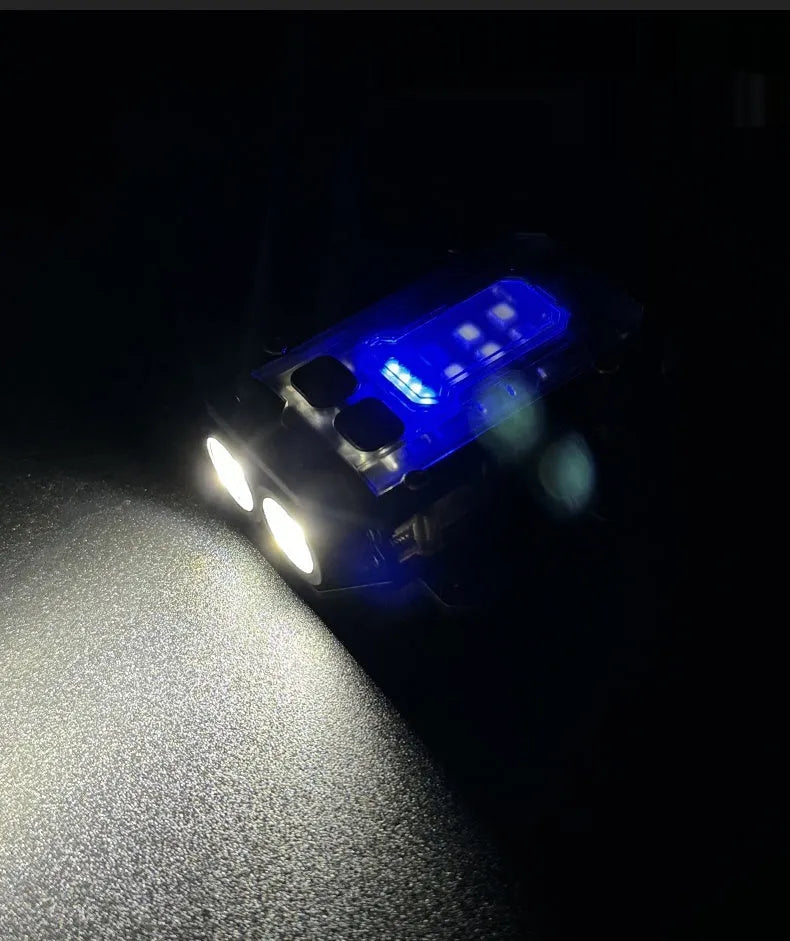 Compact black tactical warning flashlight with a USB charging cable and a clip for backpack mounting.