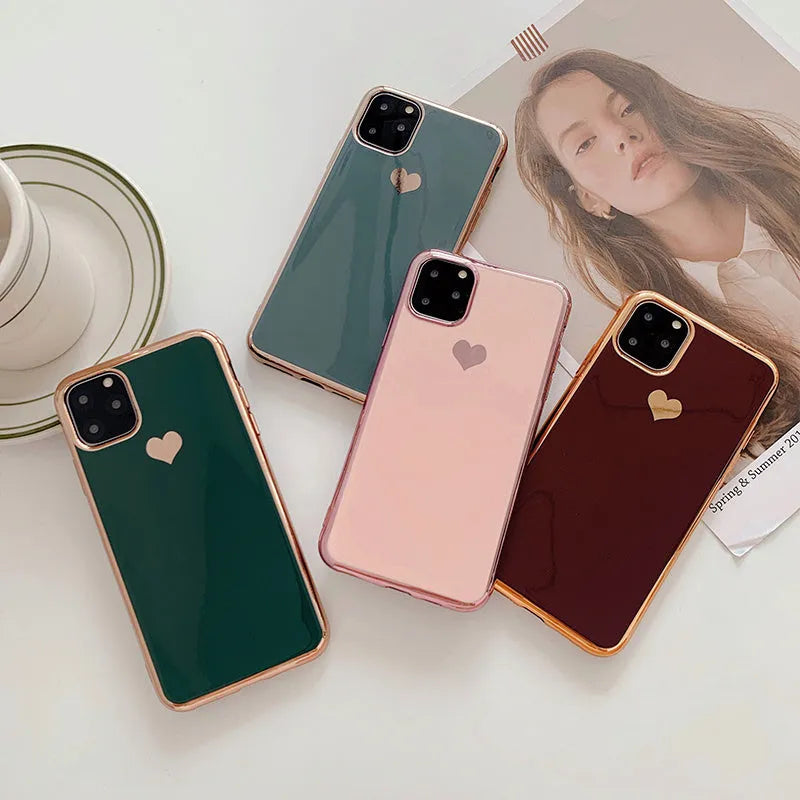 Slim TPU iPhone case in a solid colour with a luxury plating love design, shown fitted to a phone.