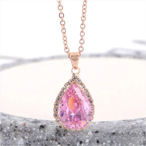 Women's alloy water drop necklace with rose gold electroplated colour and rhinestone inlays on a geometric pendant.