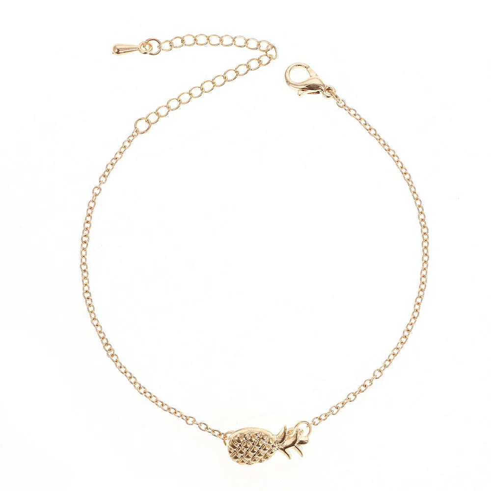 Women's alloy pineapple bracelet from XINGX series in gold or silver colour on wrist.