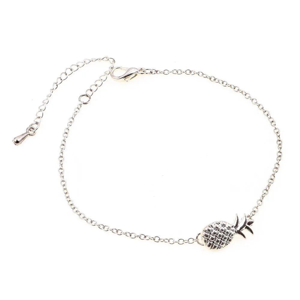Women's alloy pineapple bracelet from XINGX series in gold or silver colour on wrist.