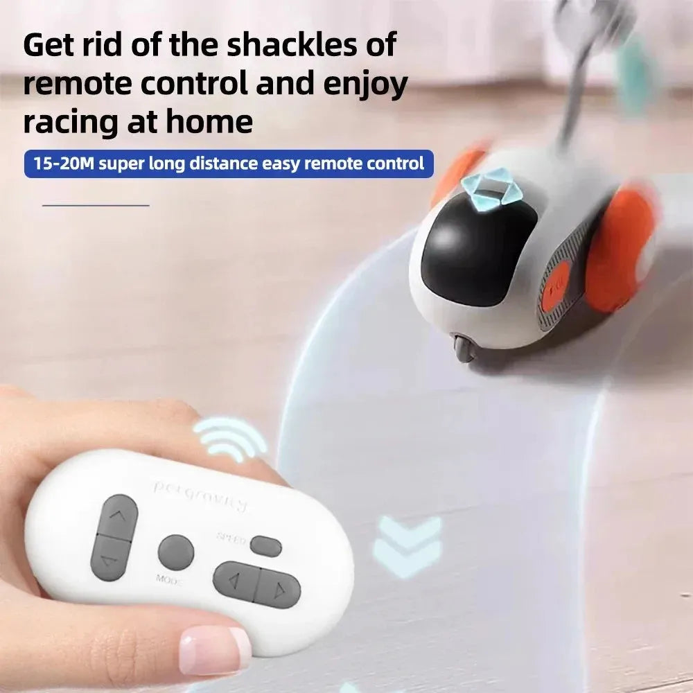 Blue remote-controlled cat toy car with feather attachment on hardwood floor