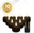 Four black LED tealight candles showing flickering flame effect