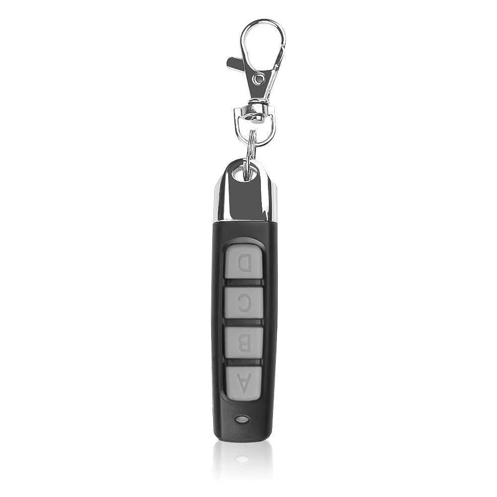 433MHz rolling door remote control in black showing compact 6.7cm design with programming buttons