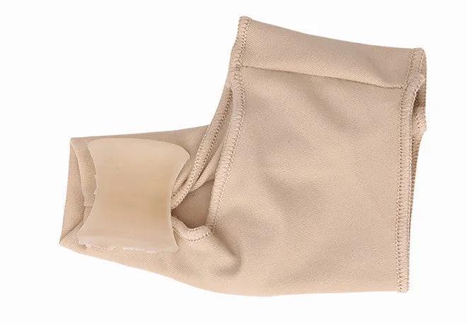 Corrective bunion relief sock with silicone gel pad and toe spacer on a foot, showing stretch fabric.