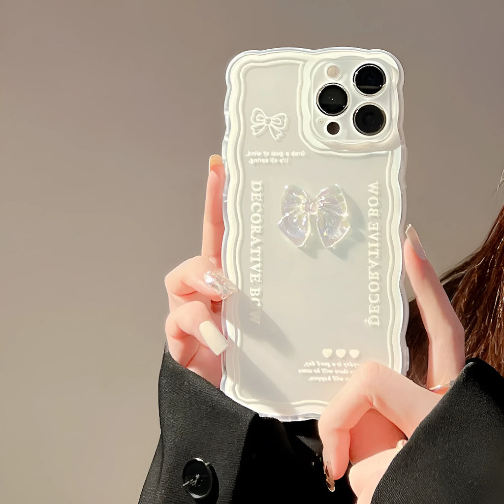 Transparent iPhone case with 3D ice-effect bow decoration on back, optional white lanyard attachment
