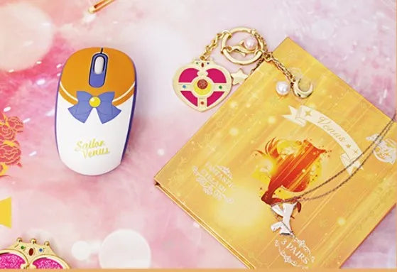 Pink Sailor Moon wireless mouse with USB receiver showing anime character design