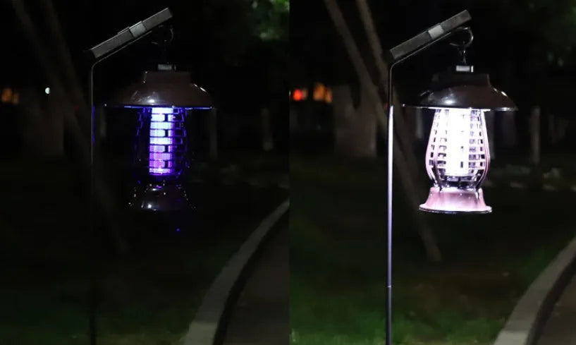 White outdoor solar mosquito lamp with solar panel on top and purple LED light beads visible.