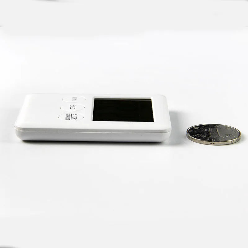 Black and white kitchen timer with countdown display and magnetic back