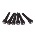 Set of six matt black ebony guitar bridge pins or string nails for acoustic guitar.