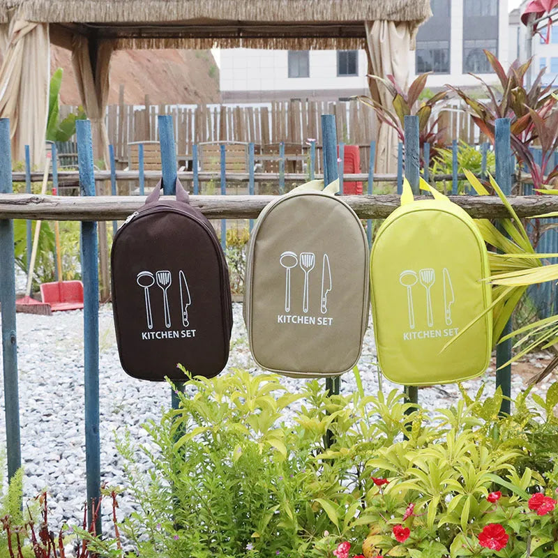 Portable picnic kitchenware storage bag containing 12 pieces of stainless steel cutlery and utensils.