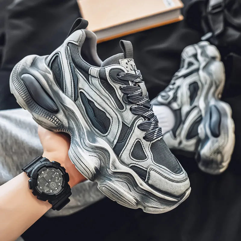 Men's black, grey, or white mesh sneakers with platform sole and lace-up front.