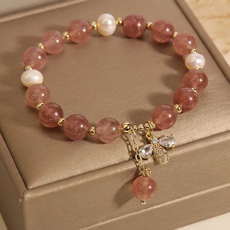 Women's strawberry quartz and freshwater pearl bracelet with zircon details and alloy charms