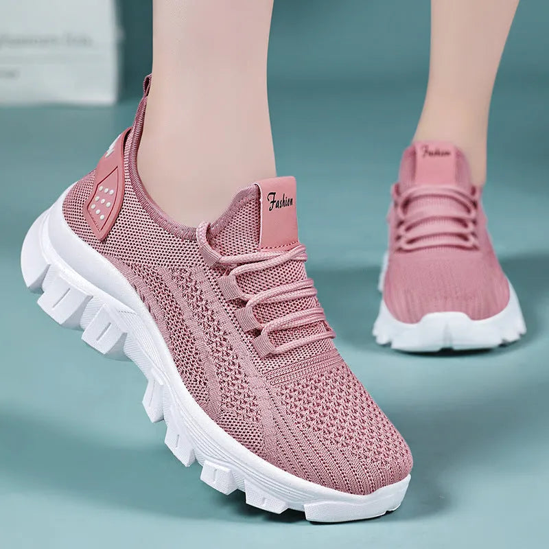 Women's white Flyknit sneaker with thick PVC sole and front lace-up design
