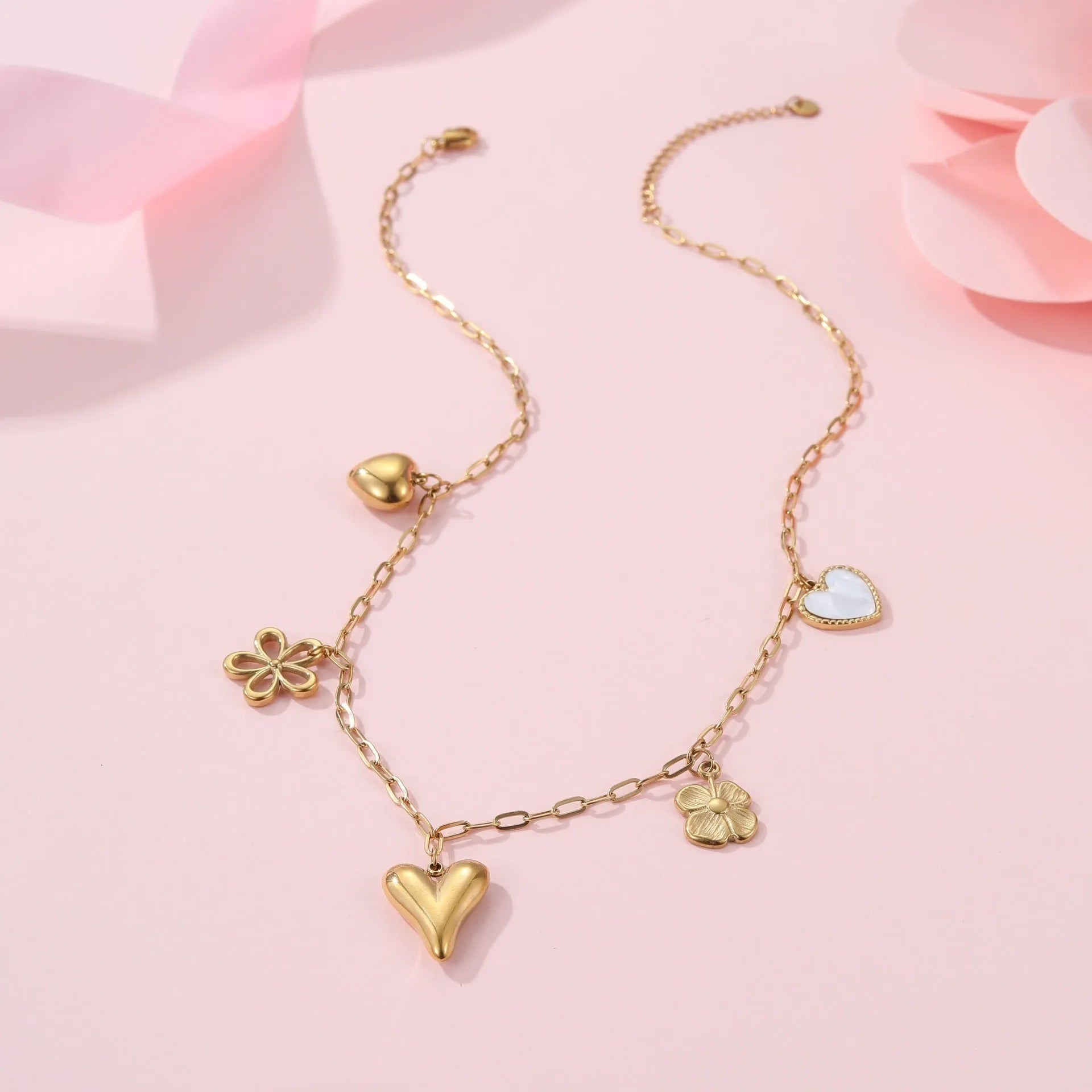 Gold plated stainless steel necklace with a choice of a geometric sun or heart pendant on a 41-50cm chain.