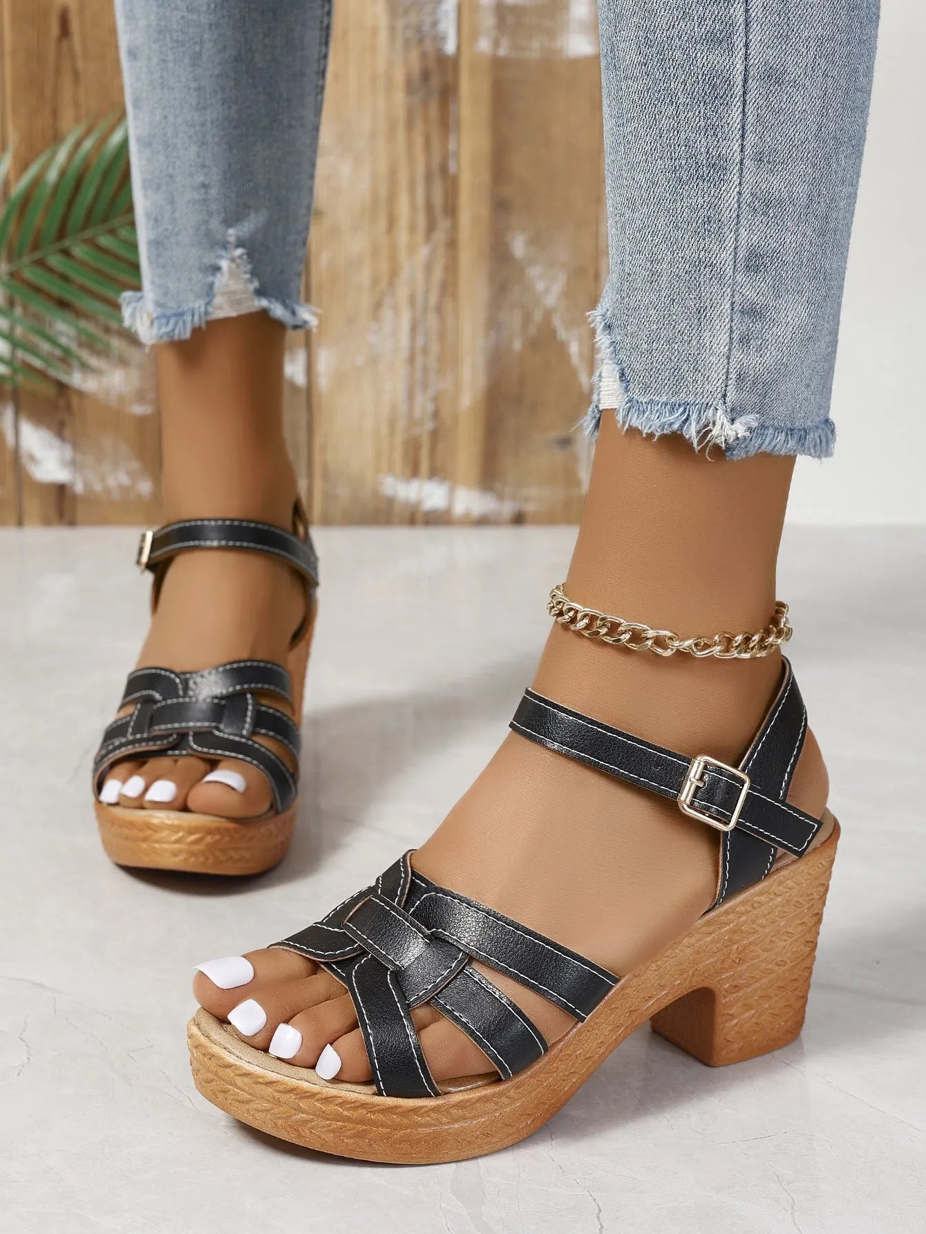 Plus size black women's peep toe sandals with chunky heel and ankle buckle strap.