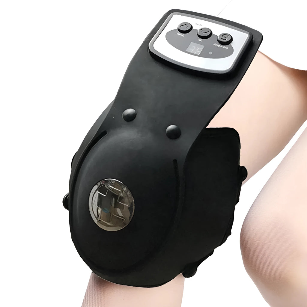 Infrared heat therapy knee and shoulder massager with pads and power adapter on a table.