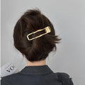 Gold and silver geometric zinc alloy hair clips showing arc, square, and triangle shapes