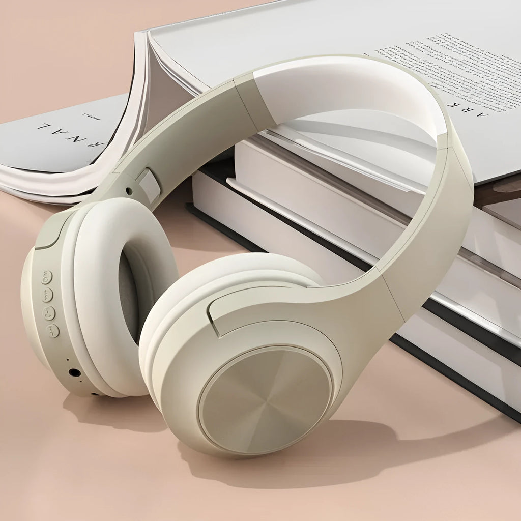 Wireless Bluetooth over-ear headset in ivory white colour with creative design and charging case