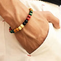 Unisex natural stone beaded bracelet with lava stones on a wrist, showing ethnic style design.
