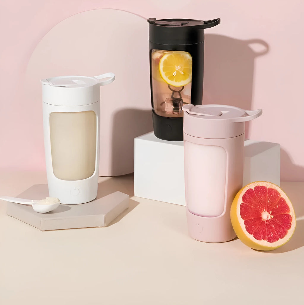 Portable automatic mixing blender cup in black, blue, pink, or white, showing compact size