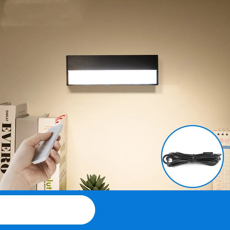 White rechargeable magnetic desk lamp with touch dimming on a metal bed frame